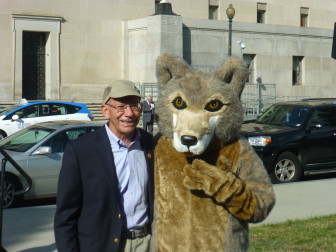 Rep. Peter DeFazio with "Journey" the wolf outside the Department of Interior.