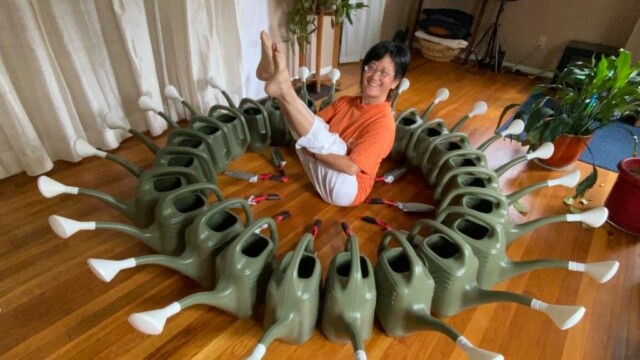 Dianne Kadonaga, surrounded by watering cans and hand trowels distributed to new native plant gardeners, a project funded by ESC’s Pollinator Protectors program